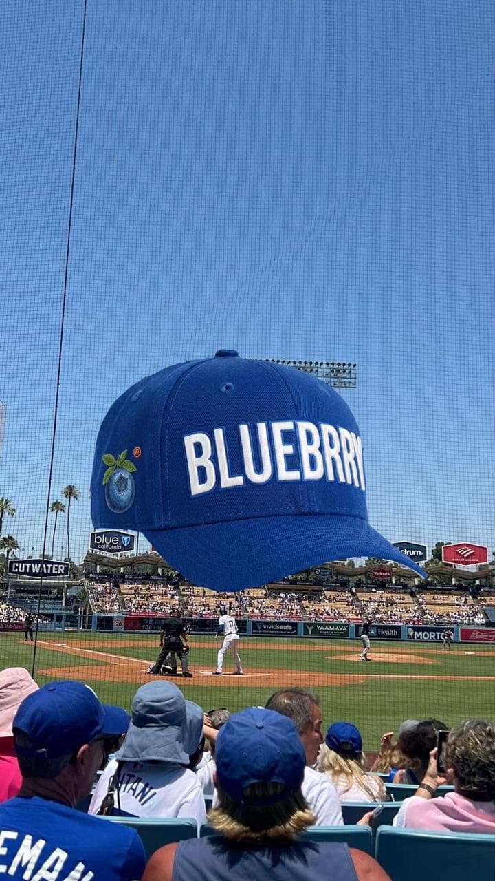 Person wearing a Blueberry cap